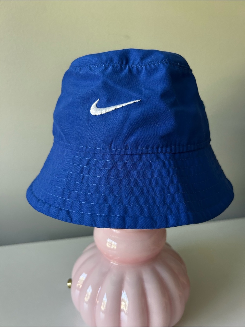 Infant blue Nike bucket hat with Velcro neck strap UPF 40+